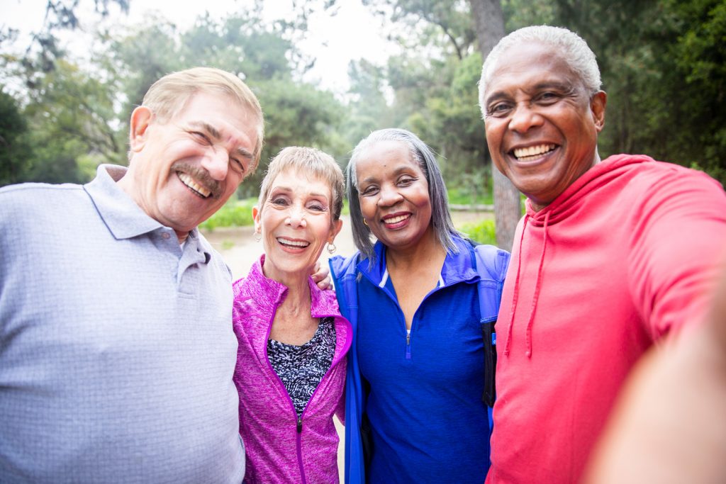 Social Media for Seniors - Group of senior friends taking a selfie I StrongLink Technology
