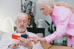 a woman and a man making an online purchase I Help for Tech-Challenged Seniors I StrongLink Technology I Sharanda Strong Henry