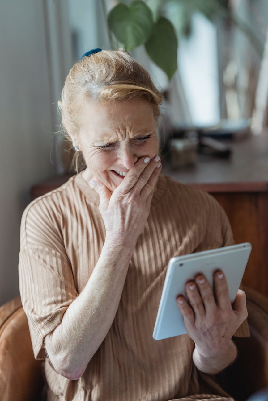 happy senior woman having video call