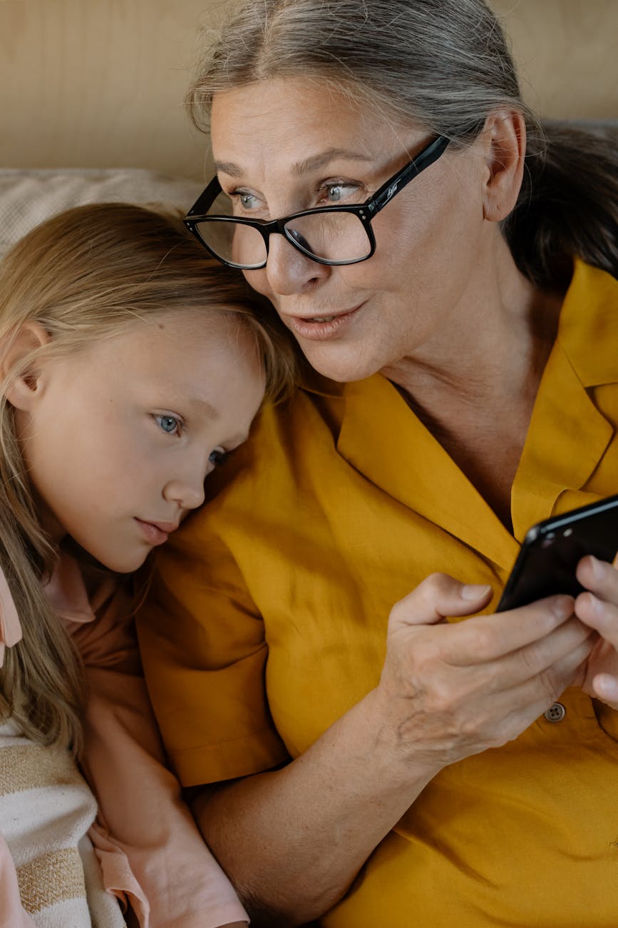 girl leaning on her grandmother