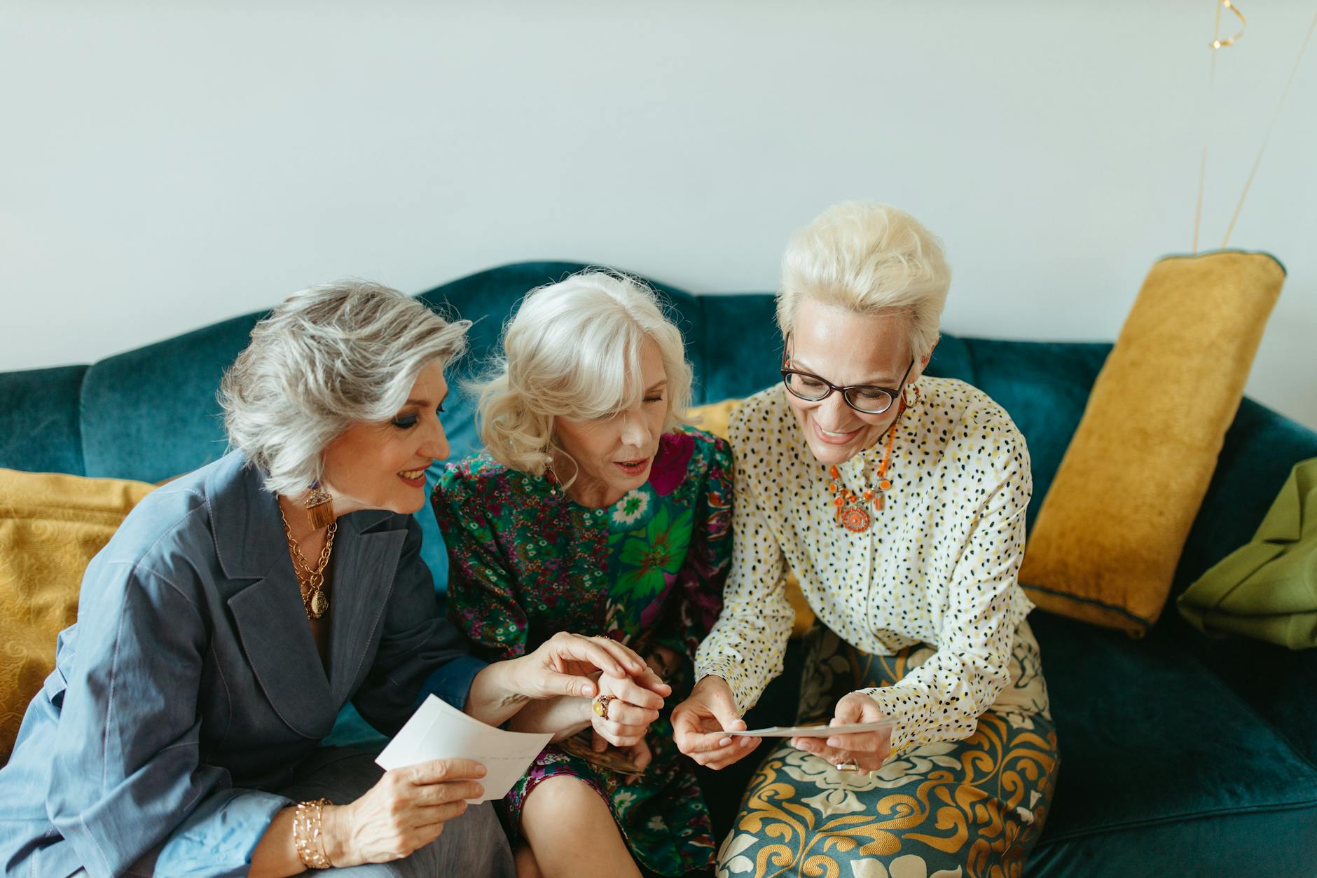 happy elderly women reminiscing about their old photos
